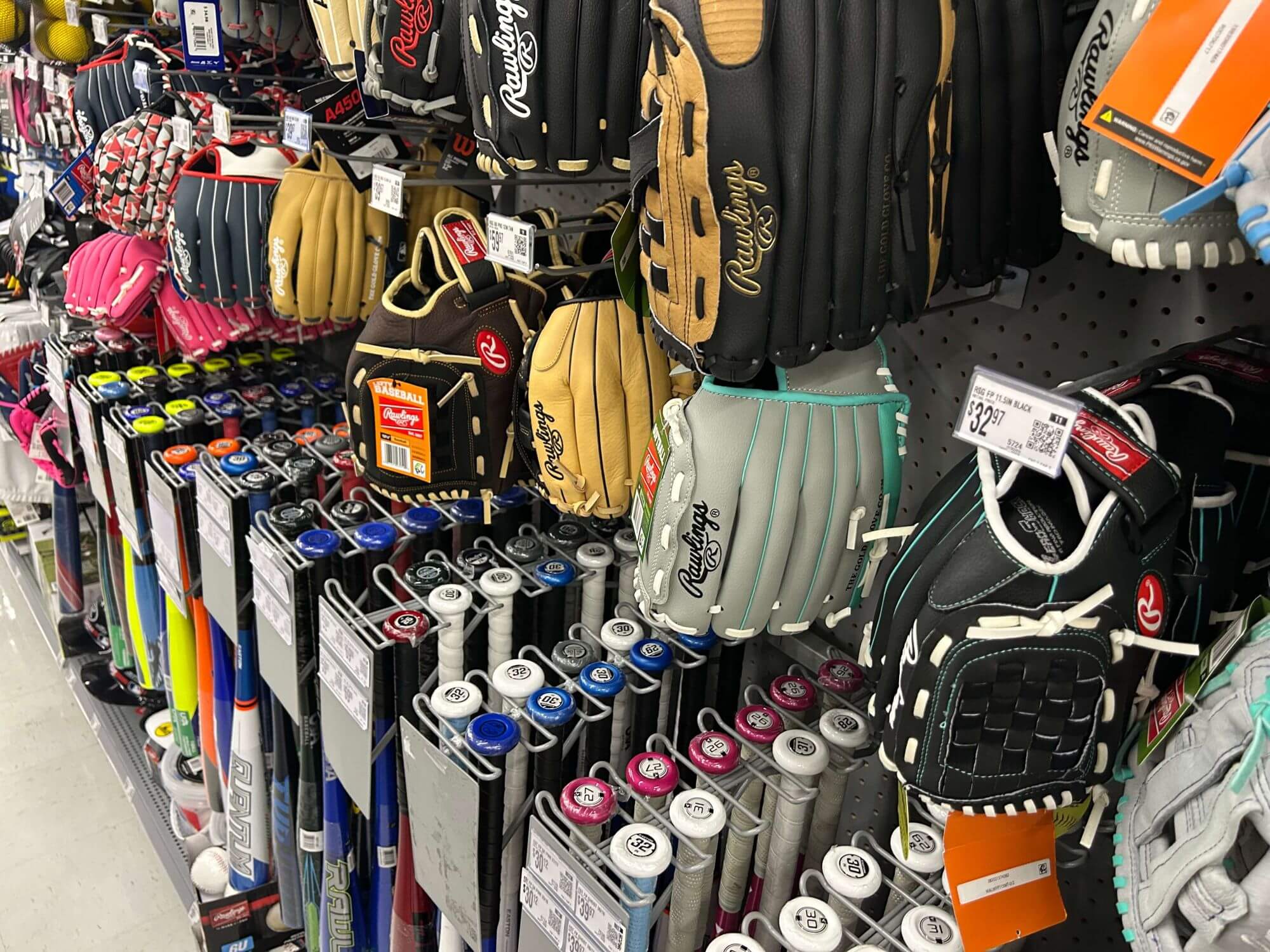 The baseball equipment section at Wal-Mart, including baseball gloves, baseball bats, and more.